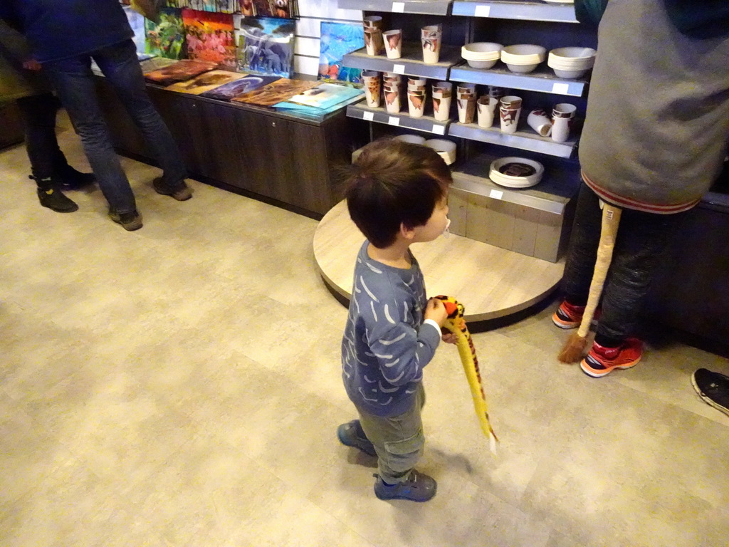 Max with a toy snake at the souvenir shop at the entrance to the Ouwehands Dierenpark zoo