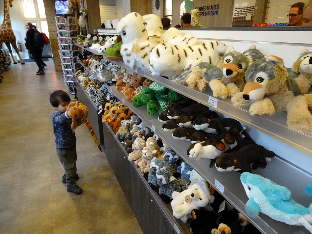 Max with a toy turtle and a toy snake at the souvenir shop at the entrance to the Ouwehands Dierenpark zoo