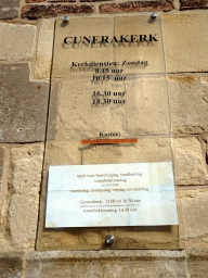 Information on the opening times at the west side of the Cunerakerk church at the Kerkplein square