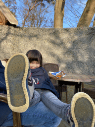 Max eating chips at the terrace of the Observatiepost building at the Ouwehands Dierenpark zoo