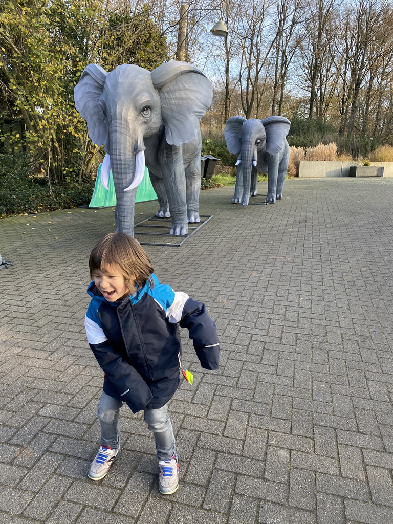 Max with China Light statues of Elephants at the Ouwehands Dierenpark zoo