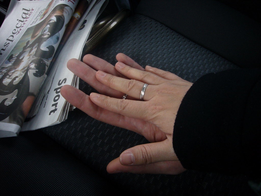 Our hands in the car to Eindhoven Airport