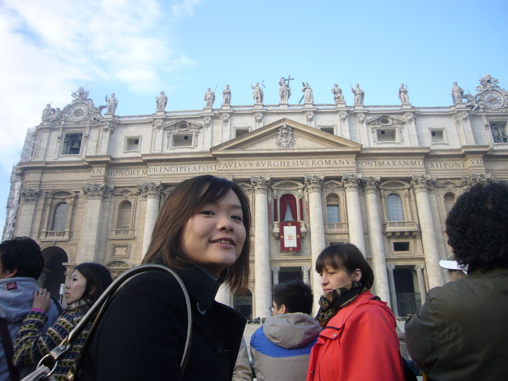 Miaomiao and the facade of St. Peter`s Basilica, with the Pope`s Window