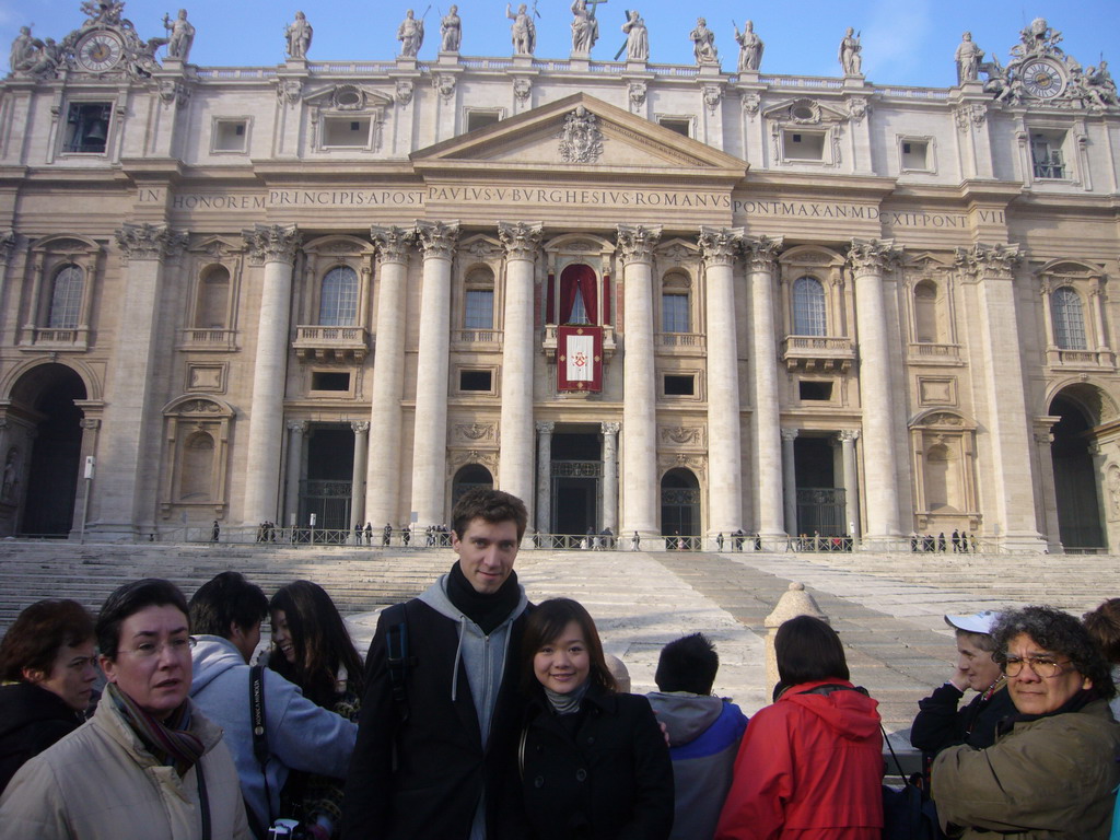 Tim, Miaomiao and the facade of St. Peter`s Basilica, with the Pope`s Window