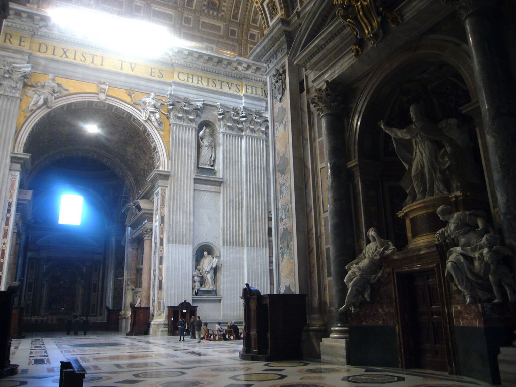 The right transept of St. Peter`s Basilica, with the Monument to Benedict XIV