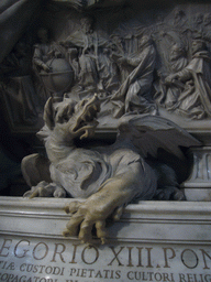Dragon statue at the foot of the Monument of Gregory XIII, inside St. Peter`s Basilica