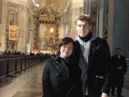 Tim and Miaomiao in the nave of St. Peter`s Basilica, with the Papal Altar, Baldacchino and the Tribune