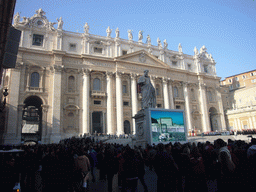 The facade of St. Peter`s Basilica, with the Statue of St. Peter and a big television screen, right before the Christmas celebrations