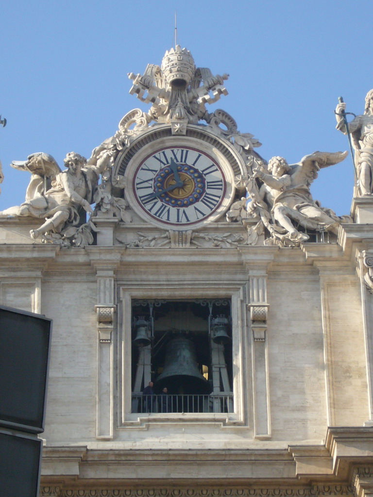 Clock and bell at the facade of St. Peter`s Basilica