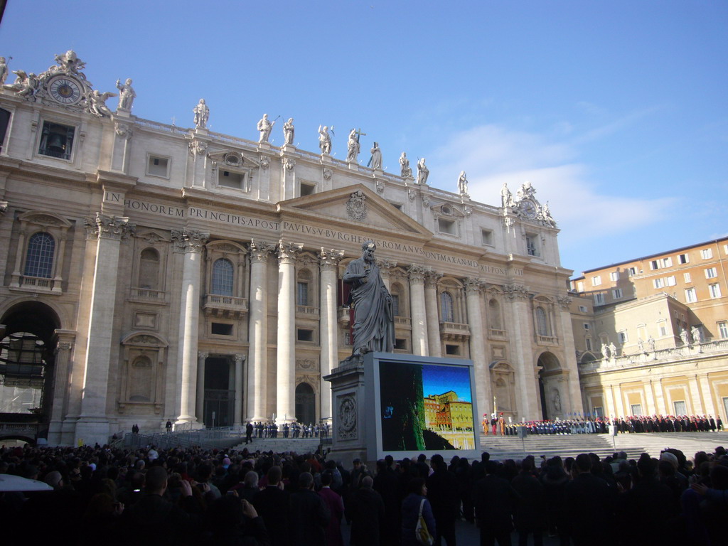 The facade of St. Peter`s Basilica, with the Statue of St. Peter and a big television screen, right before the Christmas celebrations