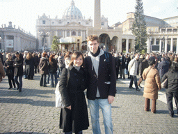 Tim and Miaomiao with the facade of St. Peter`s Basilica, the Vatican Obelisk, a christmas tree and the Nativity of Jesus, at Saint Peter`s Square, right after the Christmas celebrations