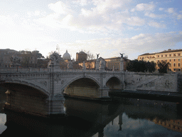 The Ponte Vitorio Emanuele II bridge over the Tiber river, and the Dome of St. Peter`s Basilica