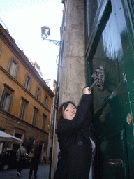 Miaomiao at a door in the Navona neighborhood