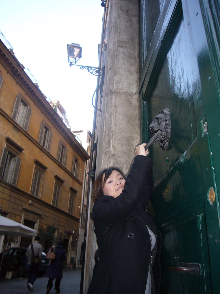 Miaomiao at a door in the Navona neighborhood