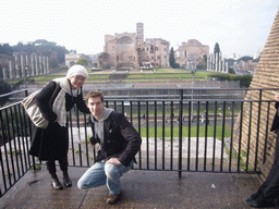 Tim and Miaomiao and a view from level 1 of the Colosseum on the Temple of Venus and Roma, the Via Sacra and the Arch of Titus at the Forum Romanum