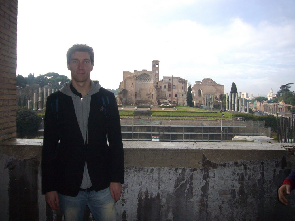 Tim and a view from level 1 of the Colosseum on the Temple of Venus and Roma, the Via Sacra and the Arch of Titus at the Forum Romanum