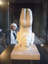 Miaomiao and a statue, in the museum at level 1 of the Colosseum