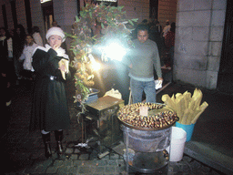 Miaomiao at a chestnut vendor at the Piazza di Spagna square, by night