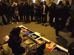 Street artist at the Via del Corso street, by night