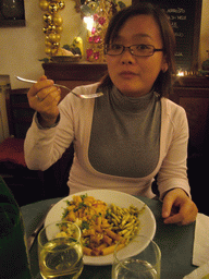 Miaomiao having dinner in a restaurant in the city center