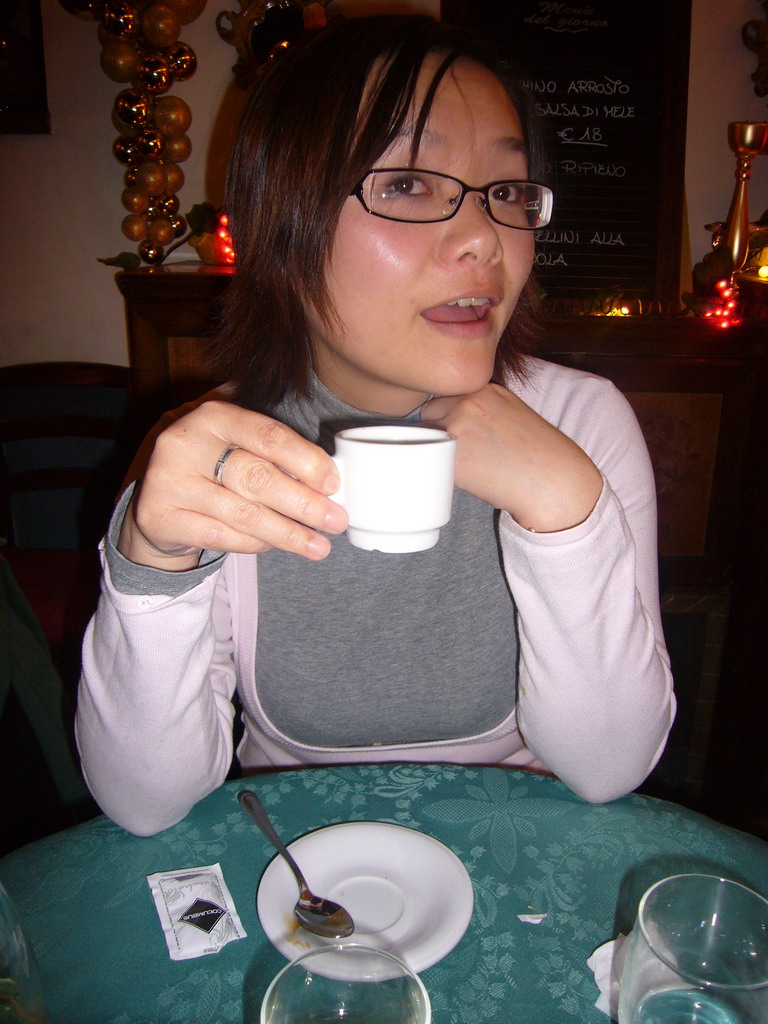 Miaomiao having coffee in a restaurant in the city center