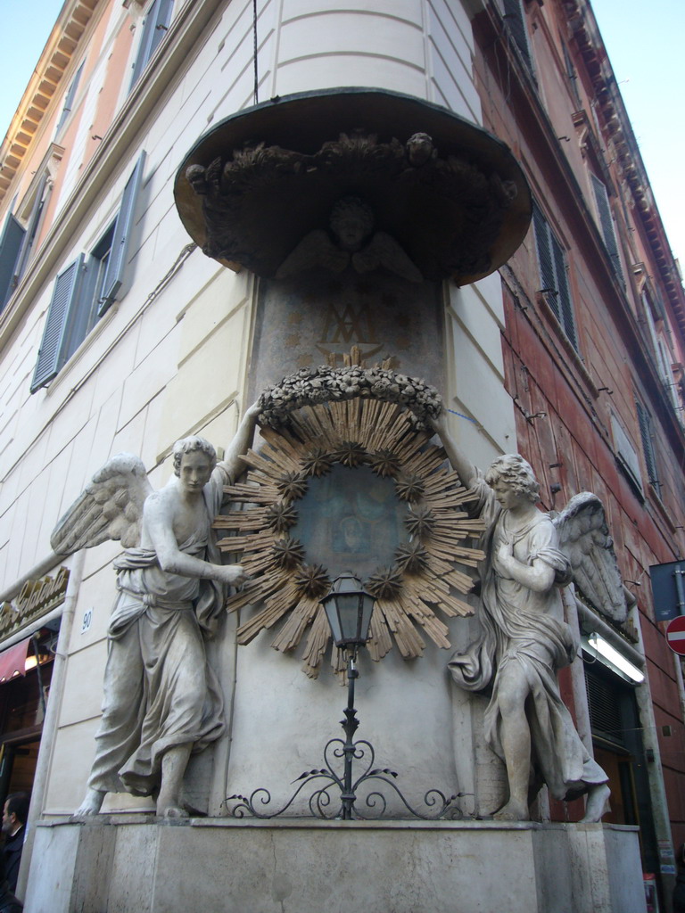 Wall decoration on the corner of a house at the Piazza di Trevi square