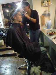 Tim at a barber shop in the city center