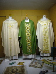 Priest robes in a shop window in the city center