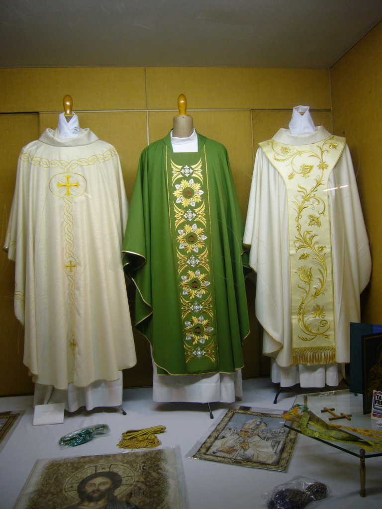 Priest robes in a shop window in the city center