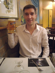 Tim with a Nastro Azzurro beer in a restaurant in the city center
