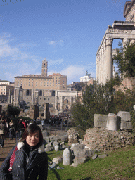 Miaomiao at the Forum Romanum, with the Temple of Antoninus and Faustina, the Arch of Septimius Severus, the Temple of Saturn, the Temple of Vespasian and Titus, the Senatorial Palace and the Monument to Vittorio Emanuele II