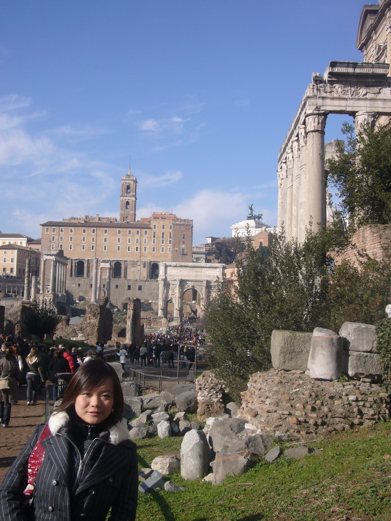 Miaomiao at the Forum Romanum, with the Temple of Antoninus and Faustina, the Arch of Septimius Severus, the Temple of Saturn, the Temple of Vespasian and Titus, the Senatorial Palace and the Monument to Vittorio Emanuele II