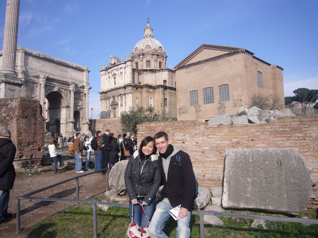 Tim and Miaomiao at the Forum Romanum, with the Column of Phocas, the Arch of Septimius Severus, the Curia Julia and the Santi Luca e Martina church