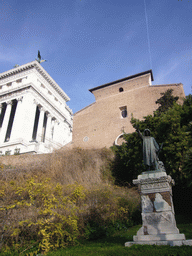 Statue at the foot of the Capitoline Hill, with the Santa Maria in Aracoeli church and the Monument to Vittorio Emanuele II