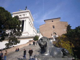 Statue of an Egyptian Lion at the foot of the Capitoline Hill, with the Santa Maria in Aracoeli church and the Monument to Vittorio Emanuele II