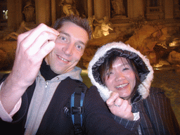 Tim and Miaomiao throwing coins in the Trevi Fountain, by night