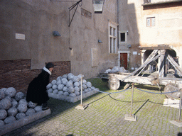 Miaomiao with stone catapult rocks at the Courtyard of the Castel Sant`Angelo