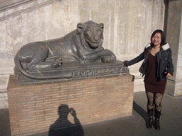 Miaomiao with an Egyptian statue of a lion, at the Cortile della Pigna square, at the Vatican Museums