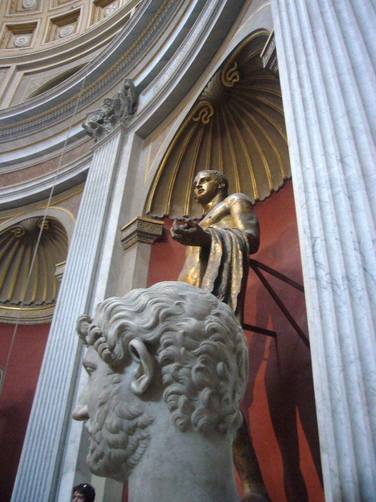 Marble statue and bronze statue of Hercules in the Round Room of the Museo Pio-Clementino at the Vatican Museums