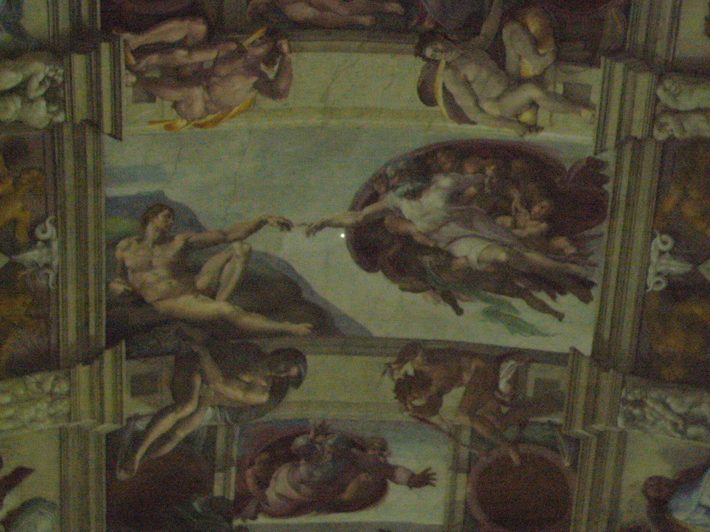 Fresco `The Creation of Adam` at the ceiling of the Sistine Chapel at the Vatican Museums