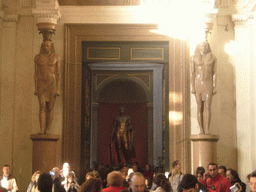 Egyptian statues and the bronze statue of Hercules in the Museo Pio-Clementino at the Vatican Museums
