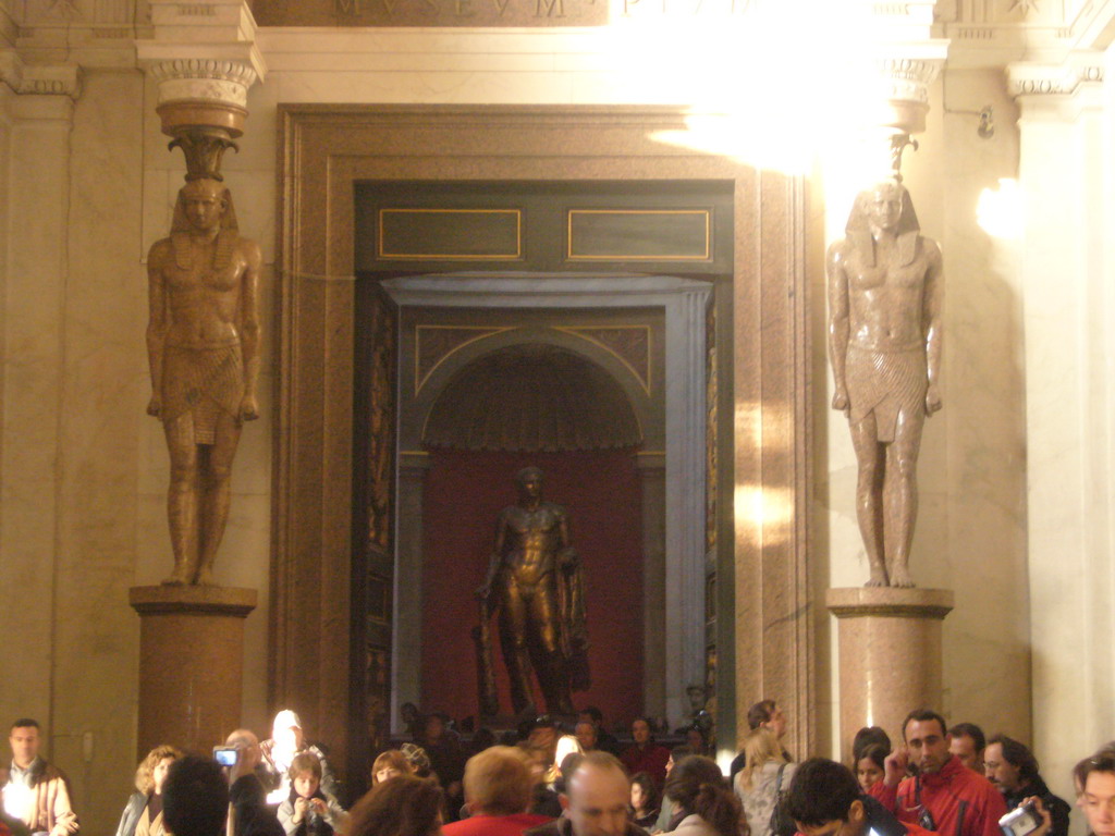 Egyptian statues and the bronze statue of Hercules in the Museo Pio-Clementino at the Vatican Museums