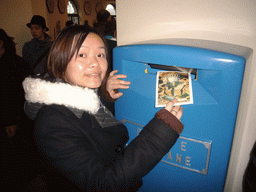 Miaomiao posting a card in the Vatican mailbox, in the Vatican Museums