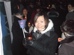 Miaomiao holding two candles at Saint Peter`s Square, at New Year`s Eve