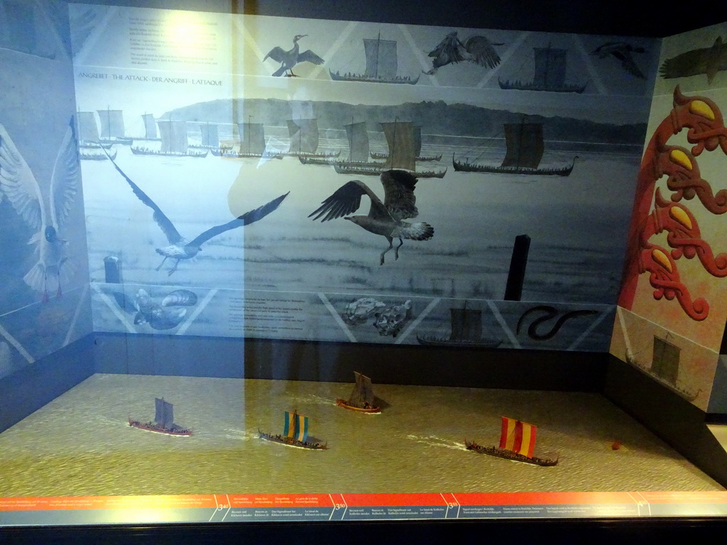 Scale models of viking ships at a reconstruction of an 11th century attack on the Roskilde Harbour, at the Middle Floor of the Viking Ship Museum, with explanation
