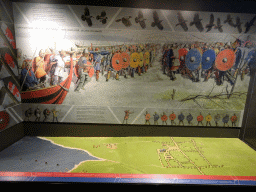 Scale models of viking ships and the town of Roskilde, at a reconstruction of an 11th century attack on the Roskilde Harbour, at the Middle Floor of the Viking Ship Museum, with explanation