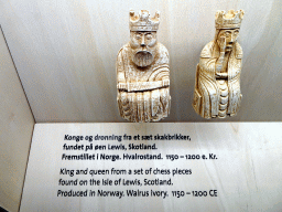 King and queen from a set of chess pieces found on the Isle of Lewis, Scotland, at the Middle Floor of the Viking Ship Museum, with explanation