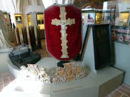 Reliefs and religious clothing, at the Roskilde Cathedral Museum at the upper floor of the Roskilde Cathedral, with explanation