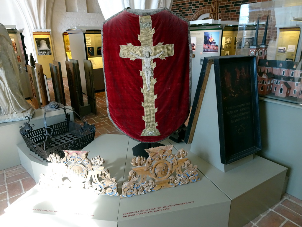 Reliefs and religious clothing, at the Roskilde Cathedral Museum at the upper floor of the Roskilde Cathedral, with explanation