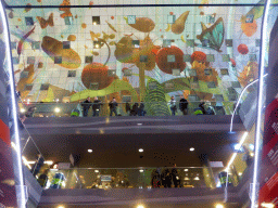 The Markthal building with its ceiling, viewed from the escalator from the lower levels